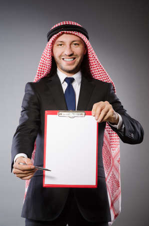Arab man with paper binderの写真素材