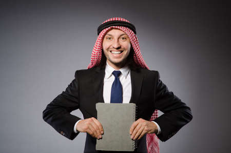 Arab student with book in education conceptの写真素材