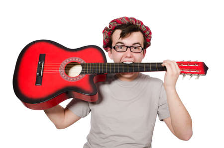 Scotsman playing guitar isolated on whiteの写真素材