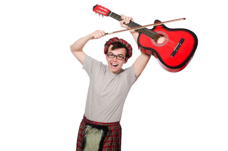 Funny scotsman with musical instrument isolated on whiteの写真素材