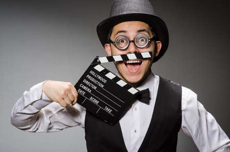Funny man with movie clapperの写真素材