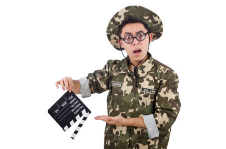 Funny soldier with movie board isolated on the whiteの写真素材