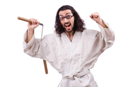 Karate man with nunchucks isolated on whiteの写真素材