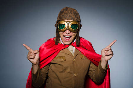 Funny pilot with goggles and helmet