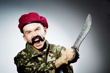 Funny soldier against the dark background
