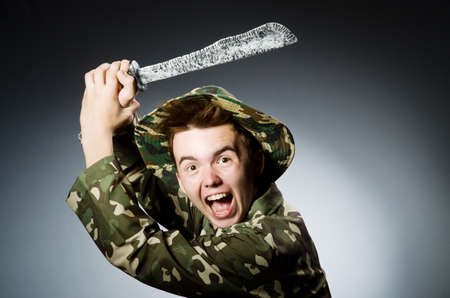 Funny soldier against the dark backgroundの写真素材