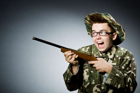 Funny soldier against the dark background