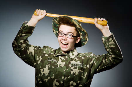 Funny soldier against the dark backgroundの写真素材