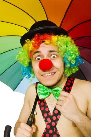 Clown with umbrella isolated on whiteの写真素材
