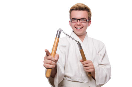 Funny karate fighter with nunchucks on whiteの写真素材