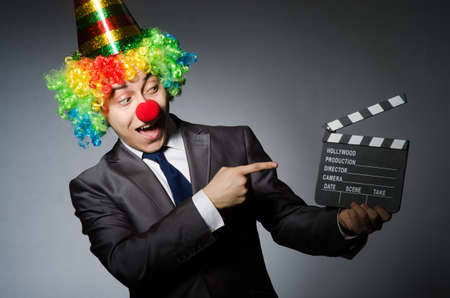 Clown with the movie board