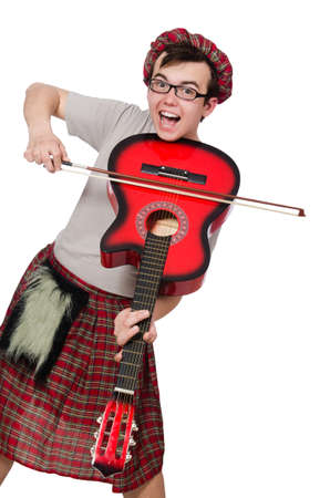 Funny scotsman with musical instrument isolated on whiteの写真素材