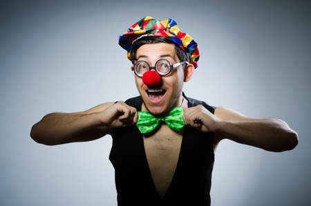 Funny clown against the dark backgroundの写真素材