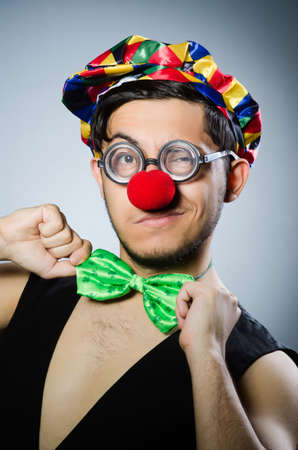 Funny clown against the dark backgroundの写真素材