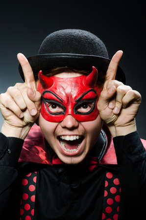 Funny devil against dark backgroundの写真素材