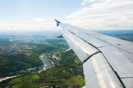 Airplane wing out of windowの写真素材