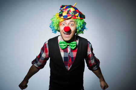 Funny clown against the dark backgroundの写真素材