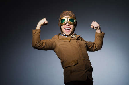 Funny pilot with goggles and helmet