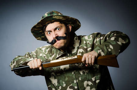 Funny soldier against the dark backgroundの写真素材