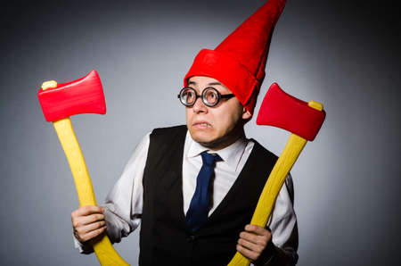 Man with axes in funny conceptの写真素材