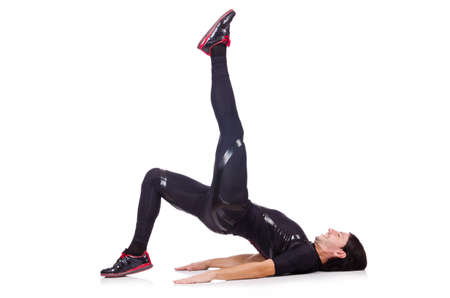 Young man doing exercises on white