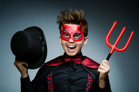 Funny devil against dark backgroundの写真素材