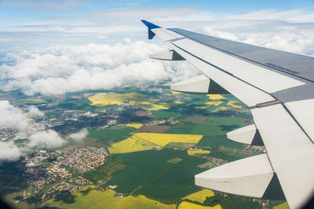 Airplane wing out of windowの写真素材