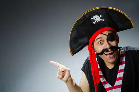 Funny pirate in the dark studioの写真素材