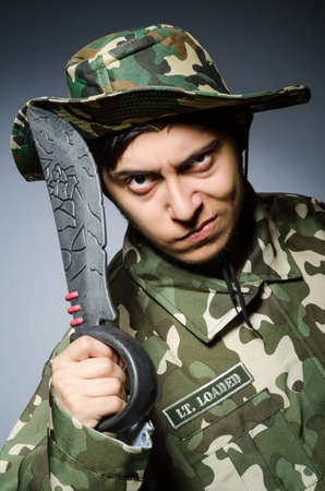 Funny soldier against the dark backgroundの写真素材