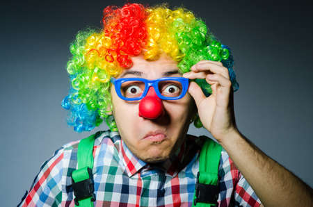 Funny clown against the dark background