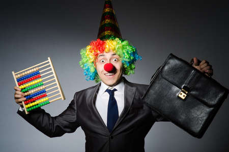 Funny clown businessman with abacus