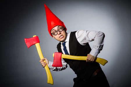 Man with axes in funny conceptの写真素材