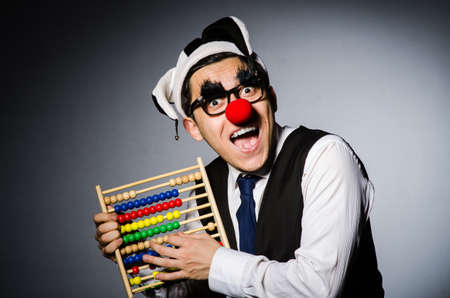 Funny clown with abacus in accounting conceptの写真素材