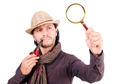 Young detective with pipe and magnifying glassの写真素材