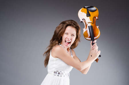 Woman artist with violin in music conceptの写真素材