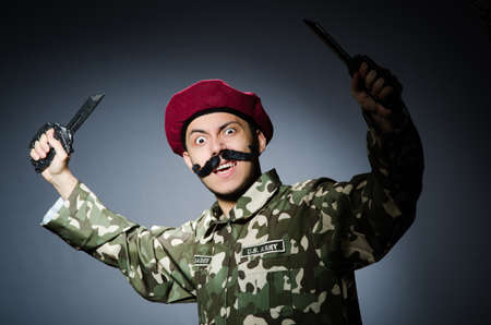 Funny soldier against the dark backgroundの写真素材