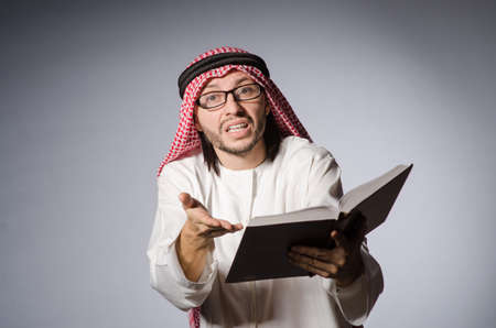 Arab student with book in education conceptの写真素材