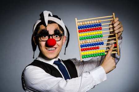 Funny clown with abacus in accounting conceptの写真素材
