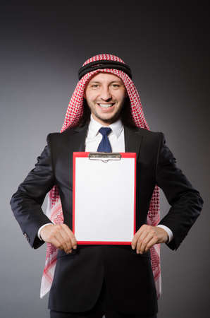 Arab man with paper binderの写真素材