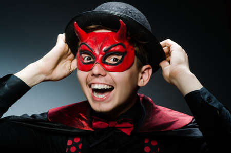 Funny devil against dark backgroundの写真素材
