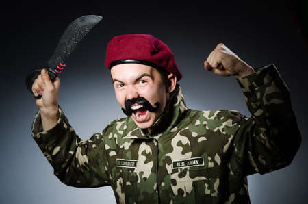 Funny soldier against the dark backgroundの写真素材