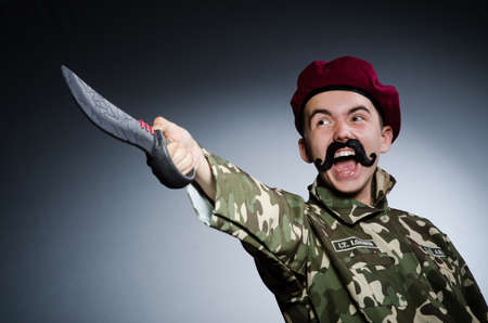 Funny soldier against the dark backgroundの写真素材