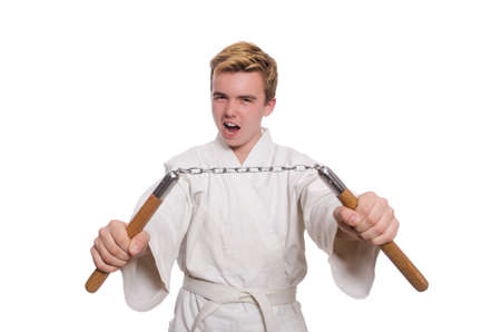 Funny karate fighter with nunchucks on whiteの写真素材