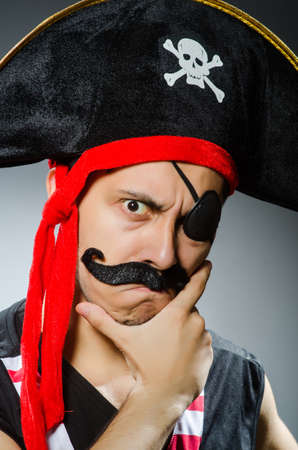 Funny pirate in the dark studioの写真素材