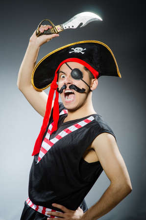 Funny pirate in the dark studioの写真素材