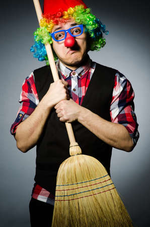 Funny clown with the broomの写真素材