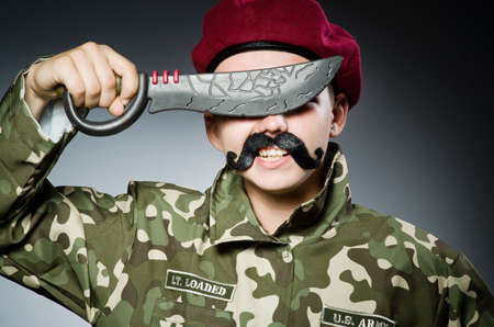 Funny soldier against the dark backgroundの写真素材