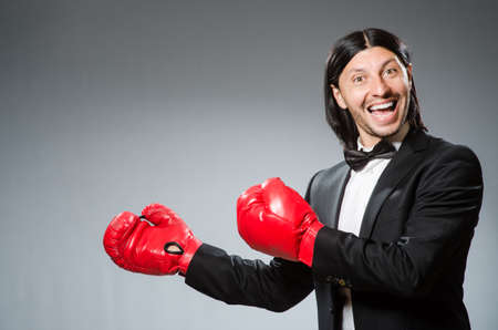 Man businessman with boxing glovesの写真素材