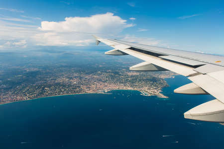 Airplane wing out of windowの写真素材