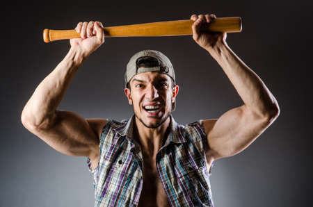 Violent man with baseball bat and hatの写真素材